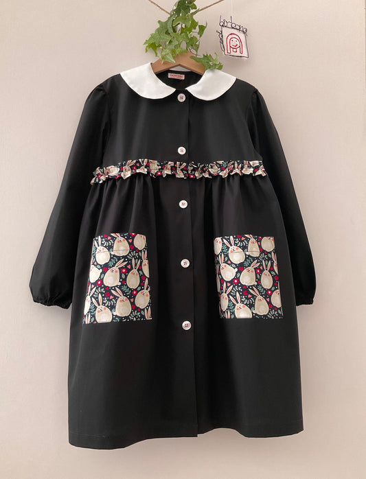 The black apron with bunnies and baby round collar for primary school